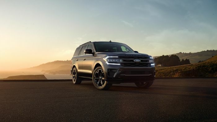 Ford Expedition SUV parked in the sunset in the desert.
